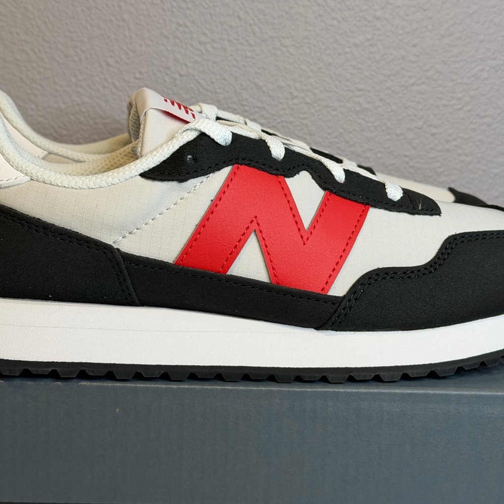 New Balance Kid’s White, Black, and Red Sneakers